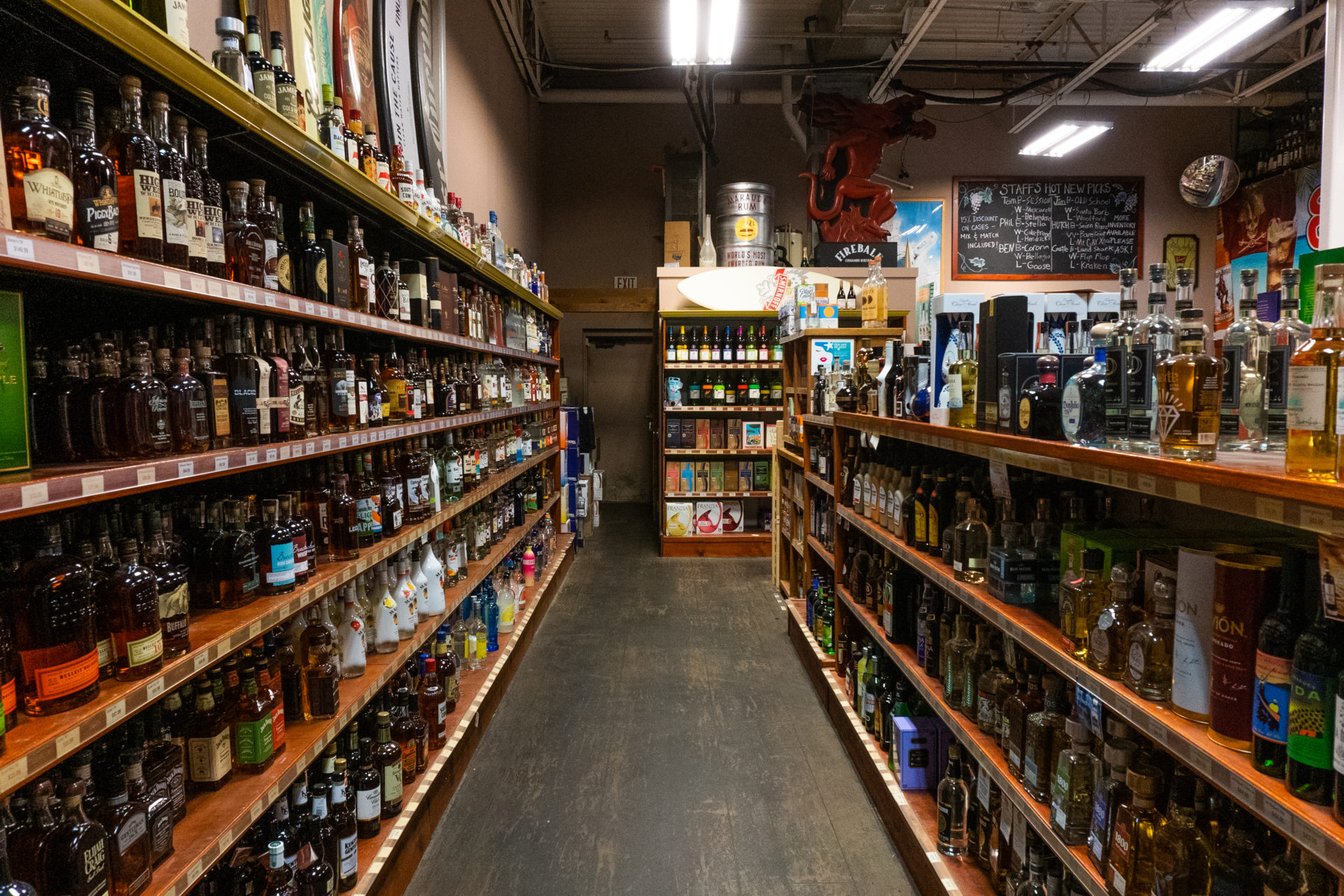 aisle of shelves stocked with top shelf alchohol selection